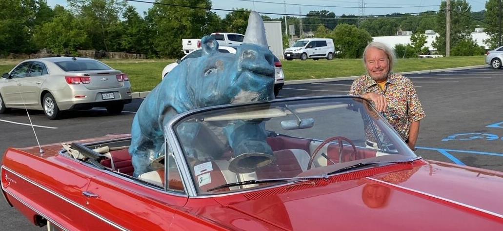 Joe Edwards with Tower Tee golf course's 'Blue Rhino'